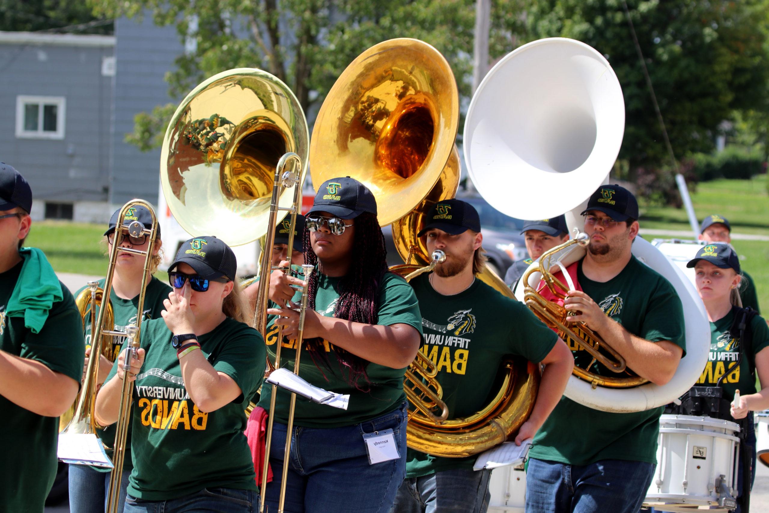 parade of students marching towards convocation